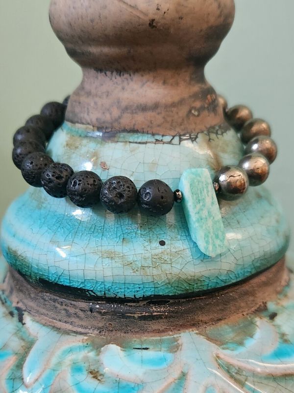 black green gemstone essential oil diffuse bracelet on ornate vase